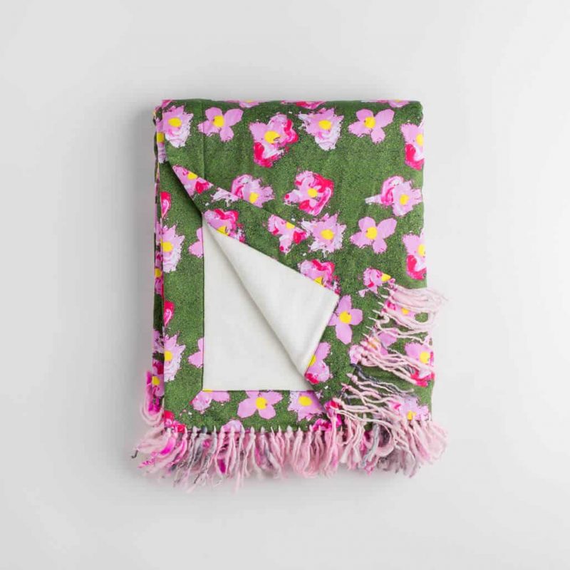 Luxury organic pink and green flower plush lined throw with hand knotted fringe folded over