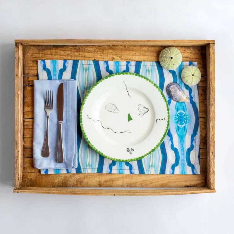 Luxury organic turquoise mirrored diamond placemat place setting with silverware plate and seashells