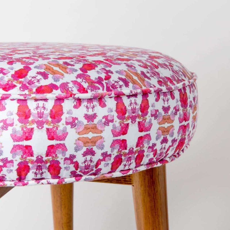 Luxury organic abstract tessellating floral pink upholstered stool close up