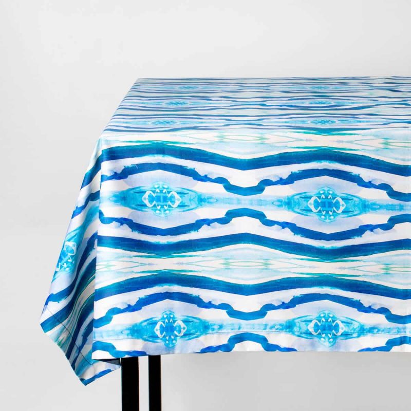 Luxury organic turquoise mirrored diamond tablecloth draped over a table