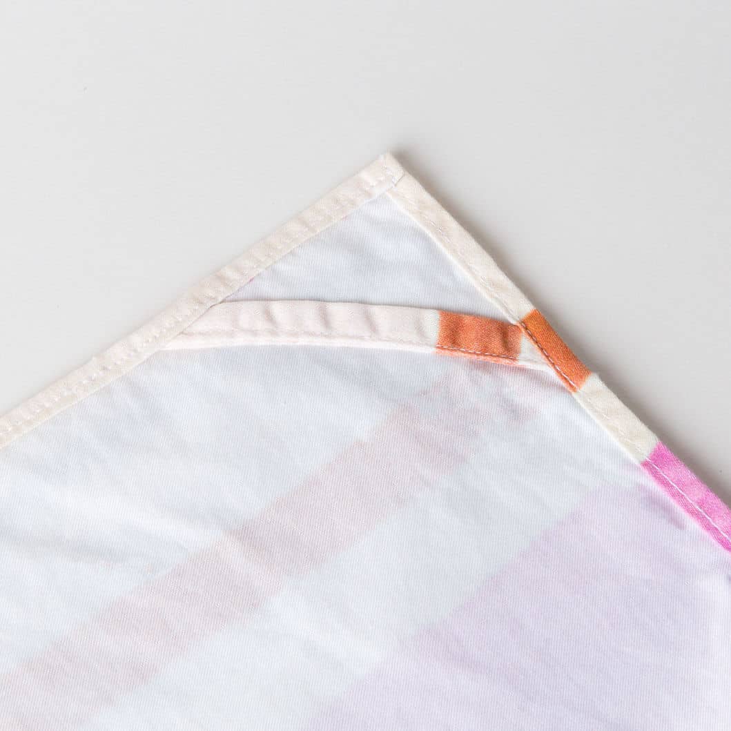 https://lindacabotdesign.com/wp-content/uploads/2018/10/Tea-towel-organic-cotton-artisan-handmade-luxury-watercolor-stripe-pink-orange-loop.jpg