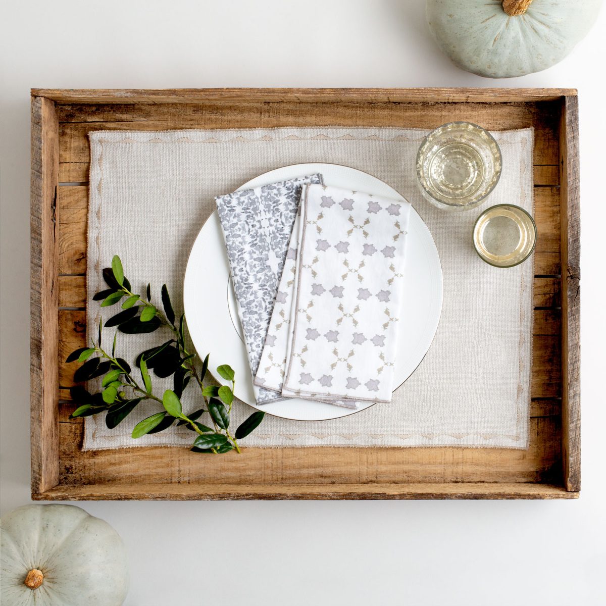 Gray linen placemat with white and gray napkins
